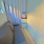 Em *
